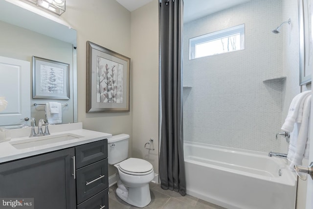 full bathroom featuring tiled shower / bath combo, vanity, toilet, and tile flooring