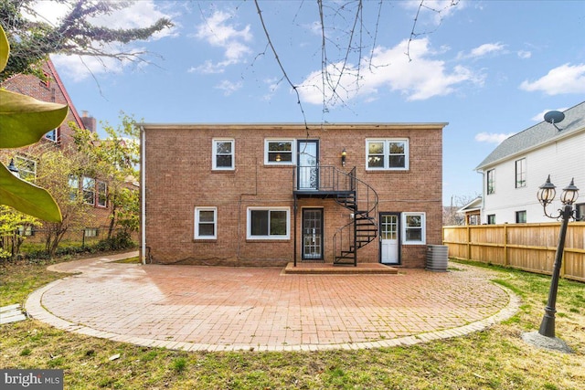 back of property with a patio