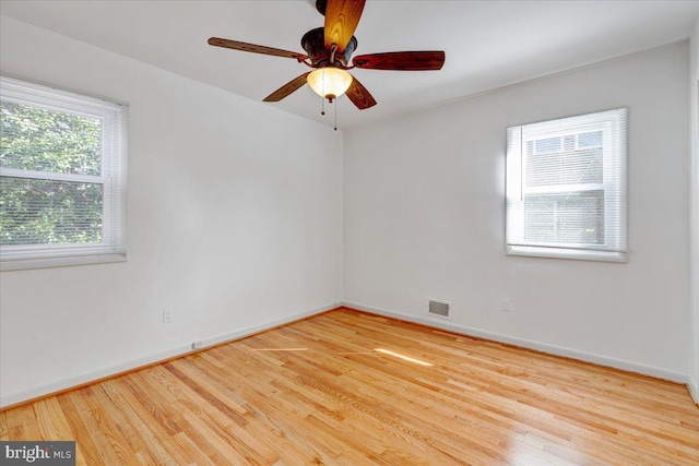 spare room with ceiling fan and light hardwood / wood-style flooring