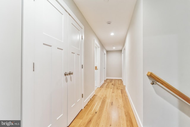 hall with light hardwood / wood-style floors