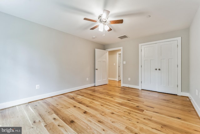 unfurnished bedroom featuring ceiling fan and light hardwood / wood-style floors