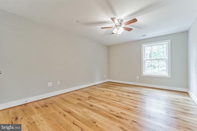 spare room with ceiling fan and light hardwood / wood-style floors