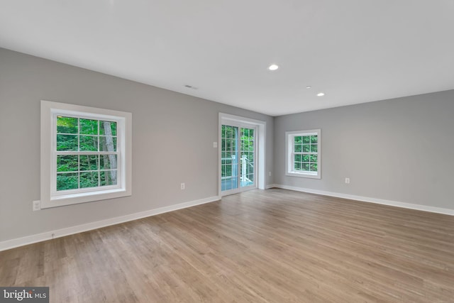 spare room featuring light wood-type flooring