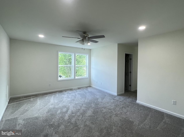 unfurnished room featuring ceiling fan and carpet flooring