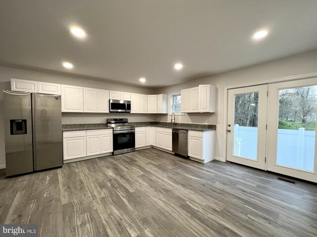 bathroom featuring vanity and hardwood / wood-style flooring