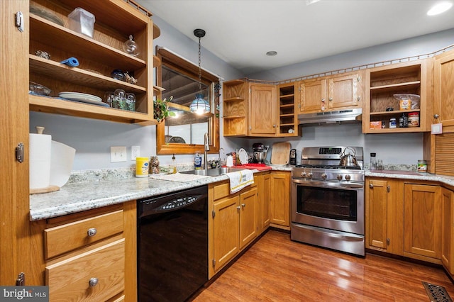 kitchen with stainless steel range with gas cooktop, hanging light fixtures, black dishwasher, wood-type flooring, and light stone countertops