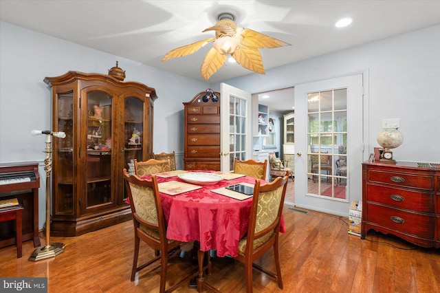 dining area featuring ceiling fan and hardwood / wood-style flooring