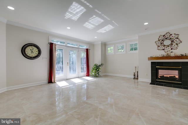 unfurnished living room with tile flooring, a wealth of natural light, and ornamental molding