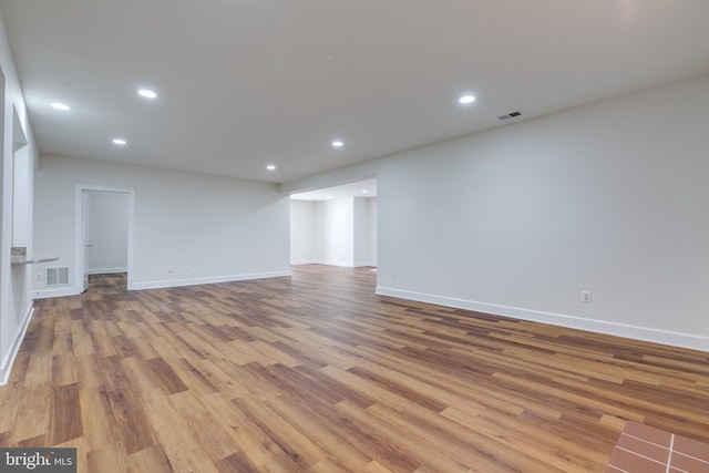 unfurnished living room featuring wood-type flooring