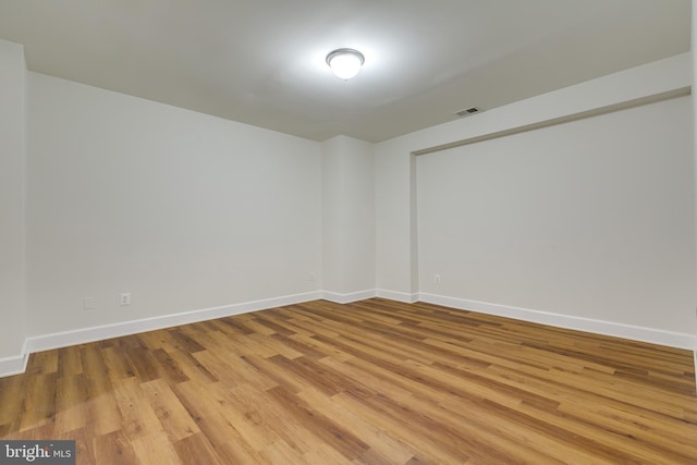 unfurnished room featuring light hardwood / wood-style floors