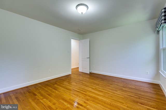 unfurnished room featuring light wood-type flooring