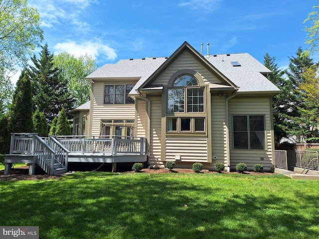 back of house with a lawn and a wooden deck