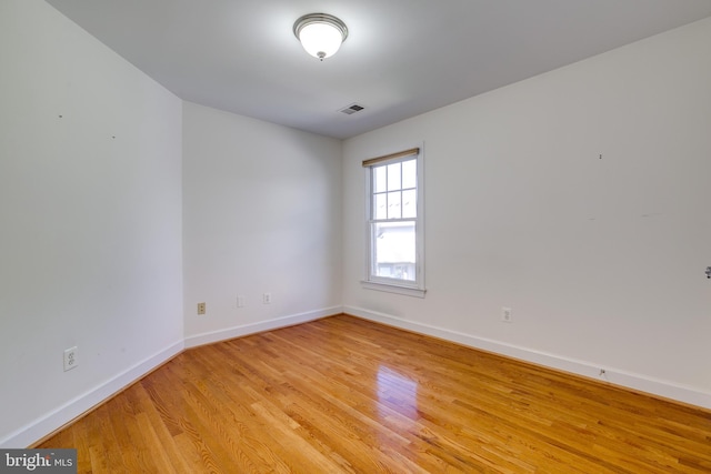 spare room with light hardwood / wood-style floors