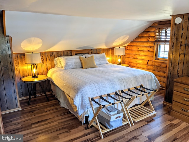 bedroom featuring dark hardwood / wood-style flooring, log walls, and lofted ceiling