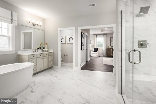 bathroom with a bidet, shower with separate bathtub, tile flooring, and vanity