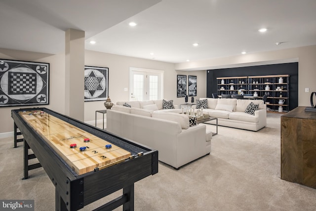 carpeted living room featuring french doors