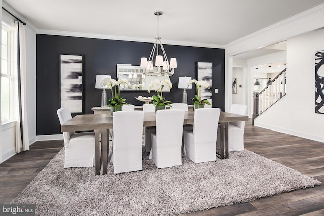 dining area with a wealth of natural light, dark wood-type flooring, crown molding, and a notable chandelier