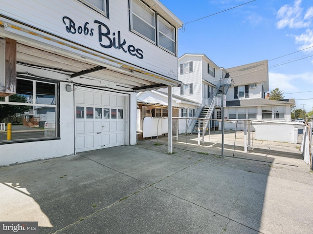 view of side of home featuring a garage