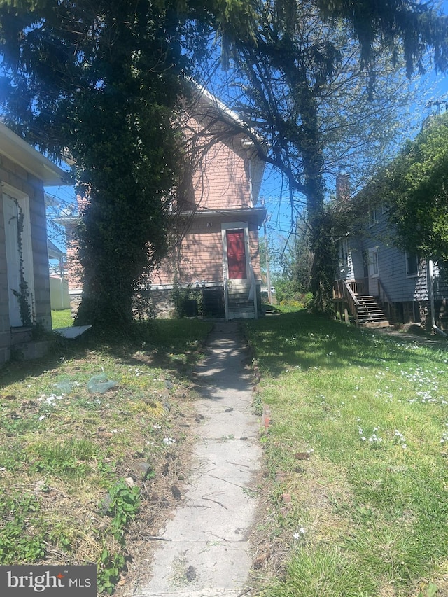 view of property exterior featuring a yard