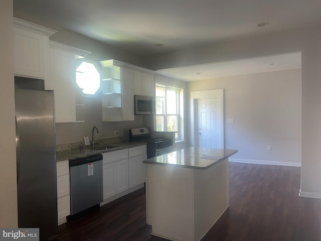 kitchen featuring white cabinets, appliances with stainless steel finishes, and a kitchen island