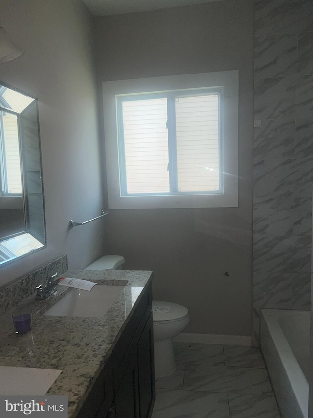 full bathroom with tile floors, toilet, oversized vanity, and tiled shower / bath combo