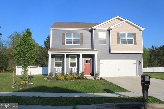 view of front of house featuring a garage and a front yard