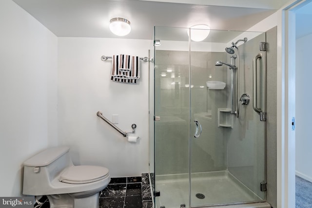 bathroom with a shower with door, toilet, and tile flooring