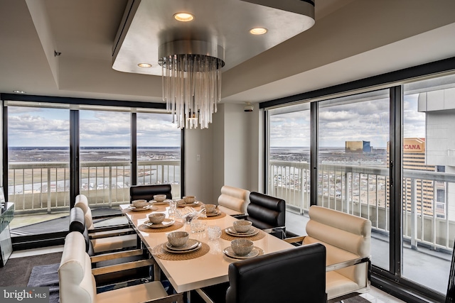 dining room with a chandelier and a wealth of natural light