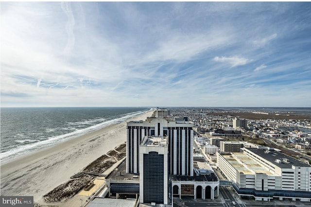 aerial view featuring a view of the beach and a water view