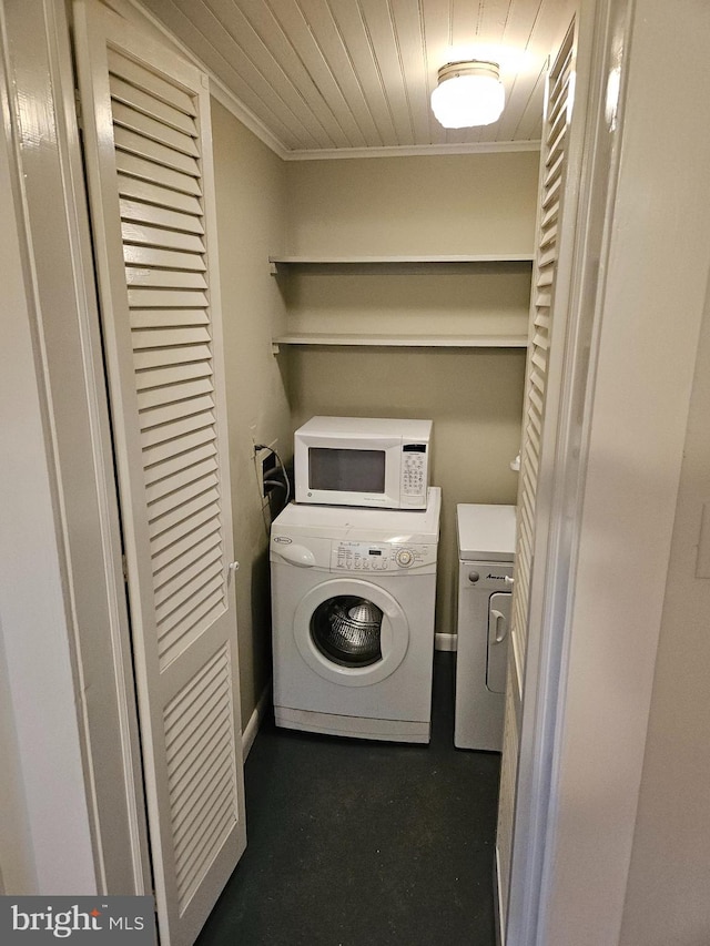 washroom with washing machine and dryer and hookup for a washing machine