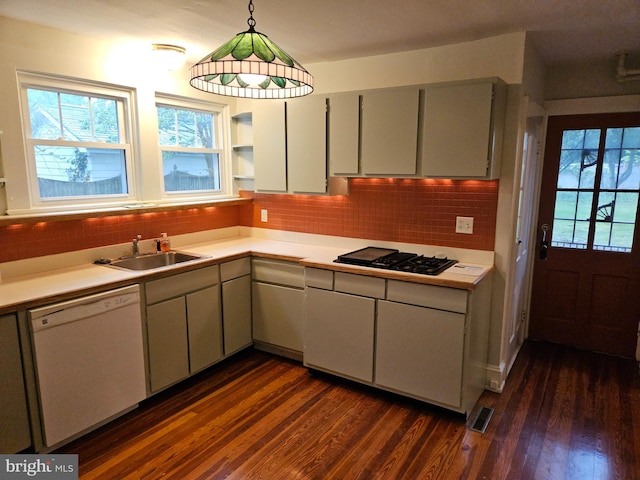 kitchen featuring black gas cooktop, dishwasher, pendant lighting, and dark hardwood / wood-style floors