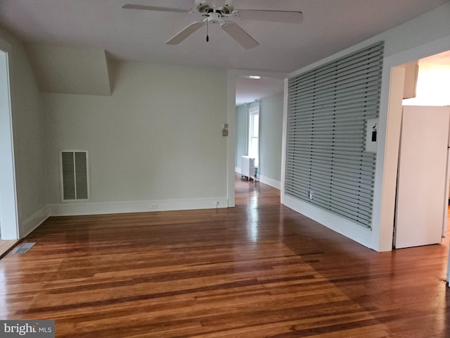 unfurnished room featuring ceiling fan and dark hardwood / wood-style floors