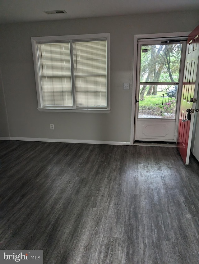 unfurnished room featuring dark hardwood / wood-style floors