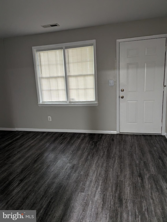 foyer entrance with dark hardwood / wood-style floors