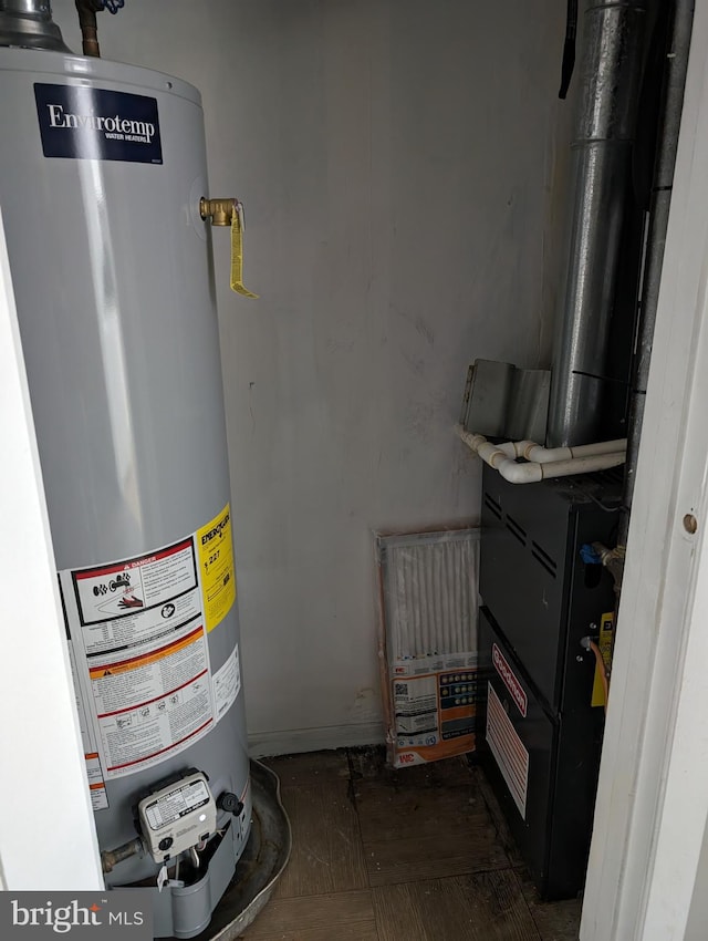 utility room with water heater