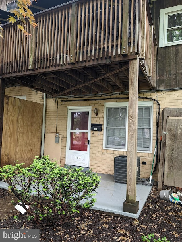 entrance to property featuring central air condition unit