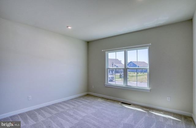 view of carpeted spare room