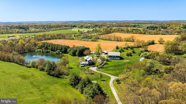 drone / aerial view featuring a rural view and a water view