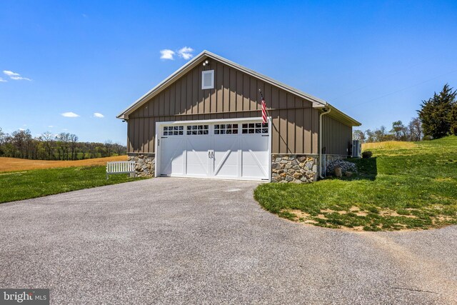 garage with a yard