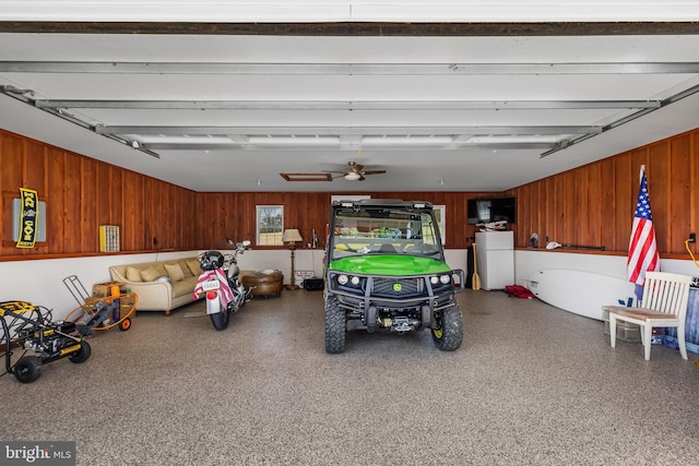 garage featuring ceiling fan and white fridge