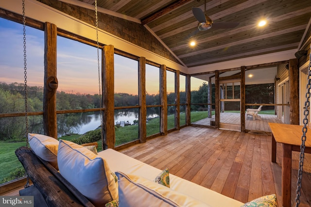 sunroom with wooden ceiling, lofted ceiling, a water view, and ceiling fan