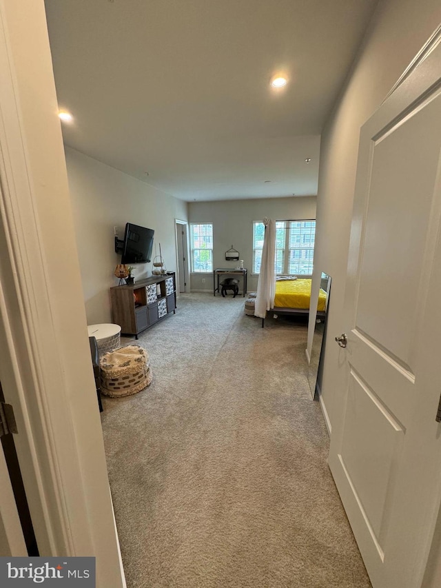 interior space featuring recessed lighting, baseboards, and carpet floors