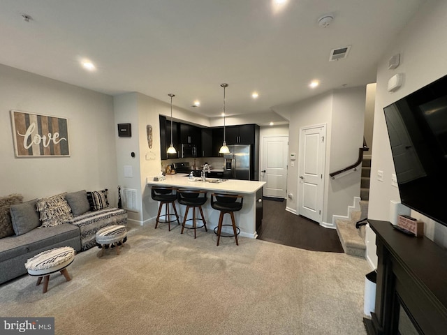 living area featuring visible vents, recessed lighting, stairway, dark colored carpet, and baseboards