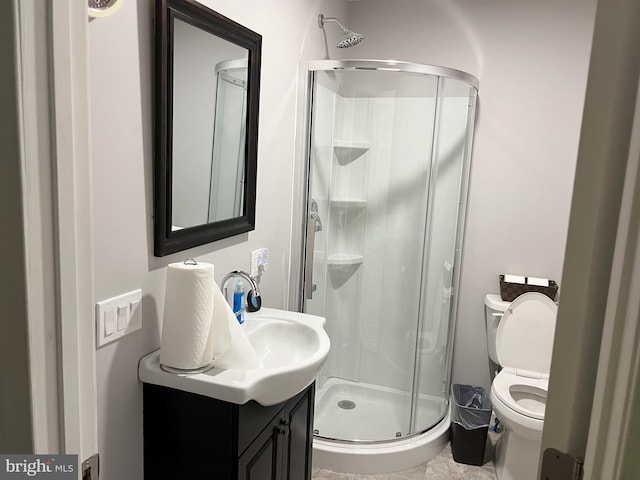 bathroom with walk in shower, toilet, tile flooring, and vanity