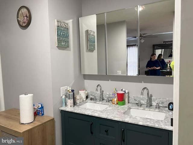 bathroom with double sink vanity and ceiling fan