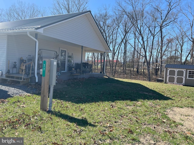 view of property exterior featuring a yard and an outdoor structure