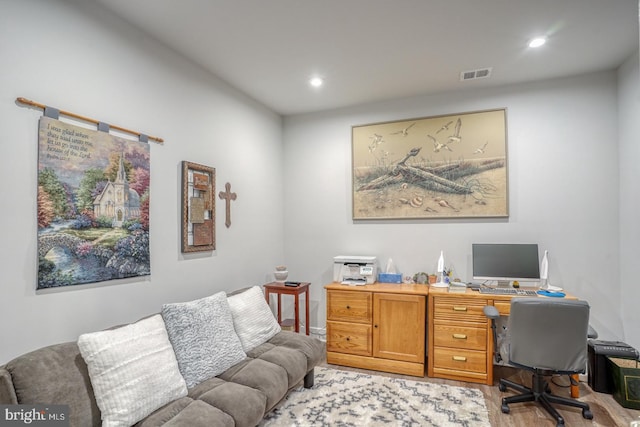 office with light hardwood / wood-style flooring