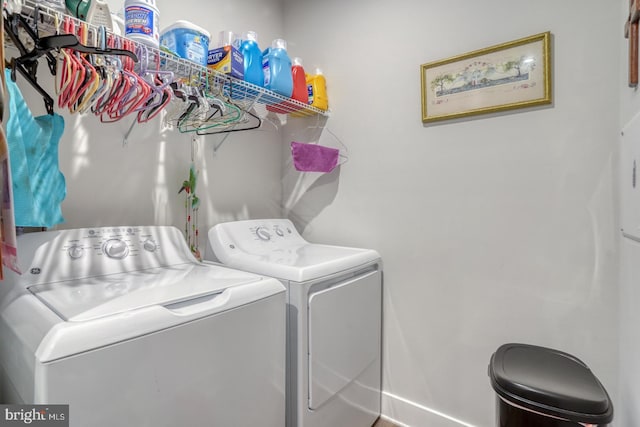 laundry area with washing machine and clothes dryer