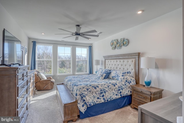 carpeted bedroom featuring ceiling fan