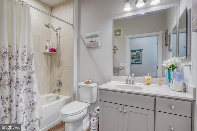 full bathroom featuring vanity, shower / tub combo, and toilet